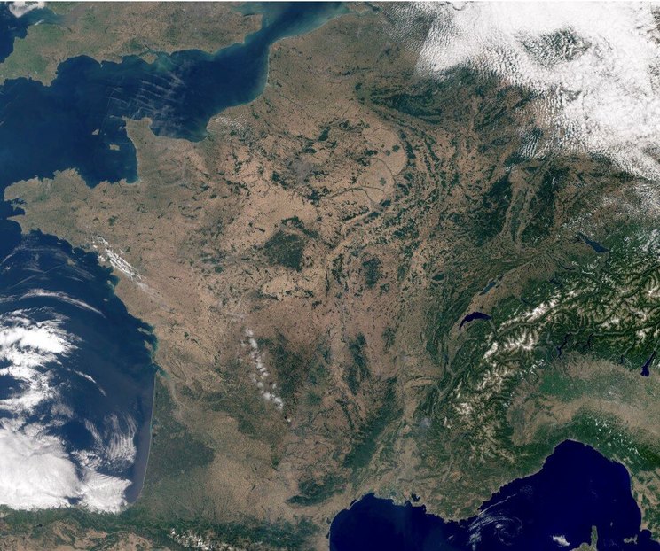 Mainland France seen by satellite on 9 July 2026: dried-out soils and scorched vegetation cover across much of the country